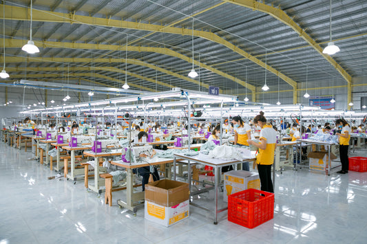 Which manufacturers provide full service from design to production for hand crafted kids clothing?