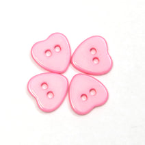 Pink heart plastic button