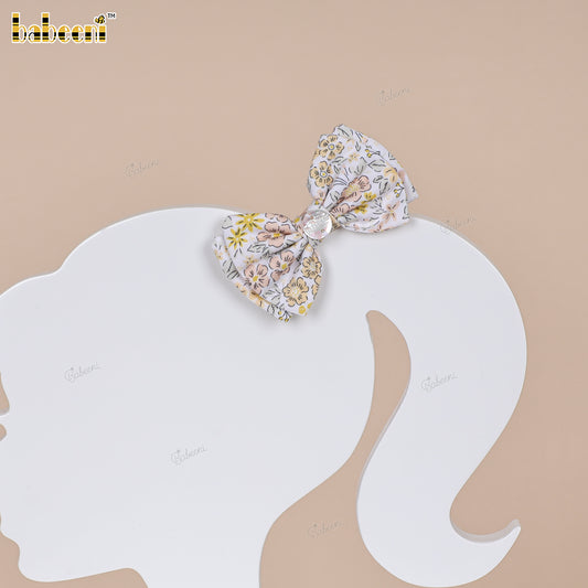 Pastel floral fabric bow with glossy center accent - HB180