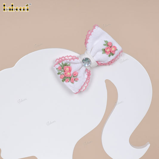 White fabric bow with pink hand-embroidered flowers and scalloped edges - HB182