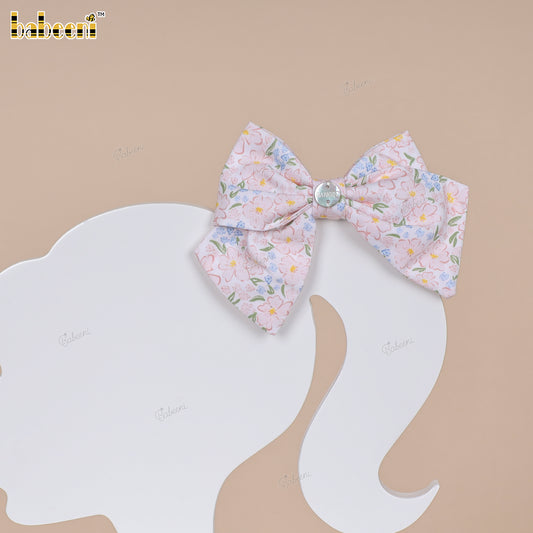 Pink floral fabric bow with glossy center accent - HB184