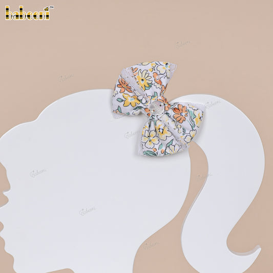 Multicolor floral fabric bow with lace trim and glossy center accent - HB186