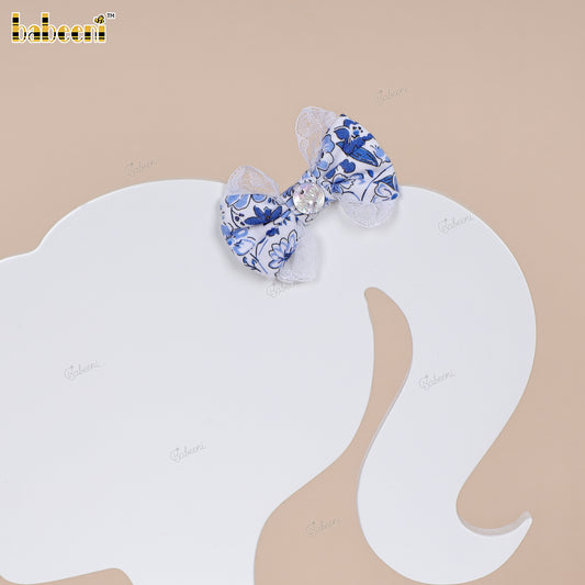 Small blue floral fabric bow with lace trim and glossy center accent - HB188