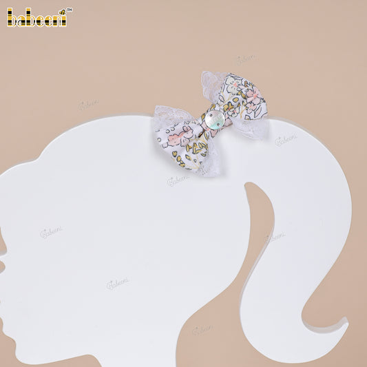Small pastel floral fabric bow with lace trim and glossy center accent - HB189