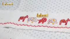 Steps to embroider a decorative patterns on smocked fabric
