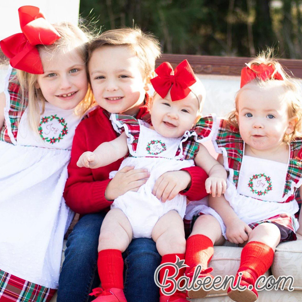 Cute babies on Christmas clothing